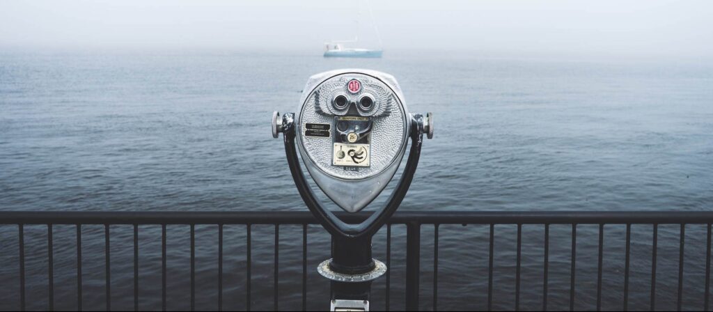 binoculars looking out to sea